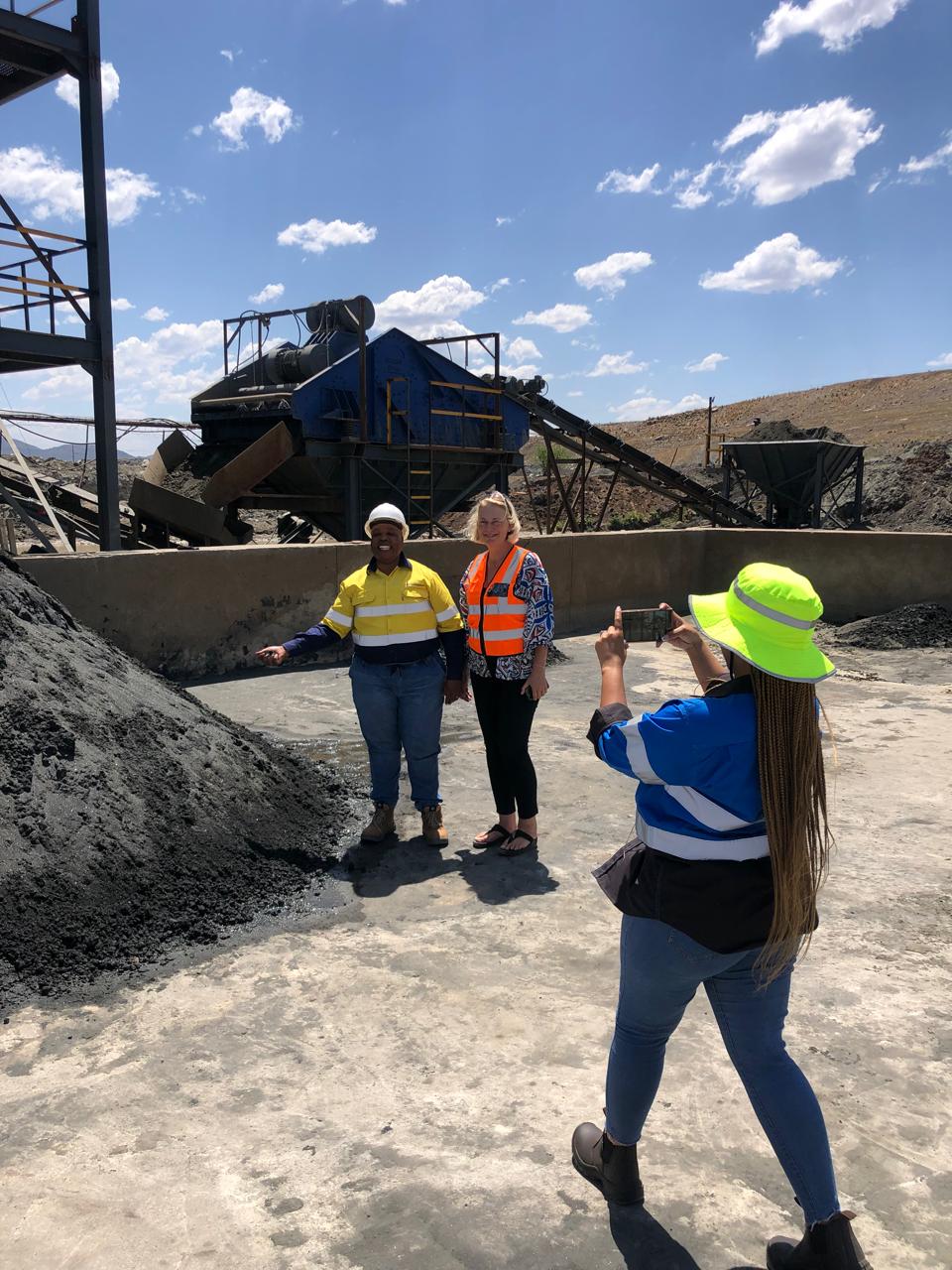 Team reviewing the crusher and screening plant at a mineral processing site