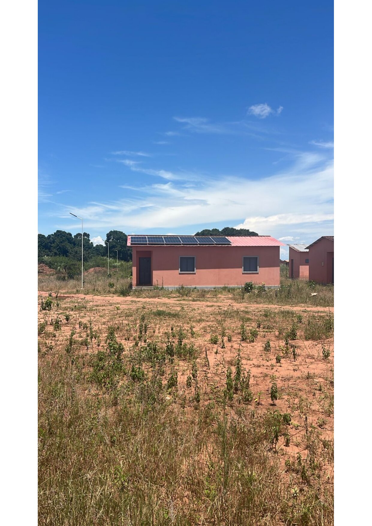 Completed home with rooftop solar panels installed, Angola